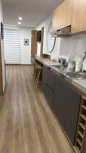 Fridge, stovetop, coffee/tea maker, electric kettle