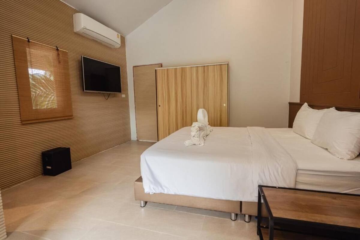 Suite, Balcony, Pool View | In-room safe, iron/ironing board, free WiFi