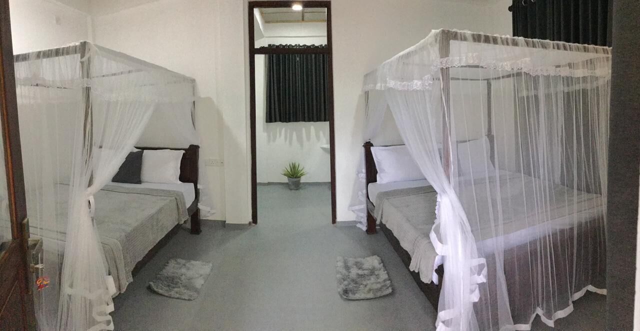 Deluxe Quadruple Room | Desk, laptop workspace, iron/ironing board, free WiFi