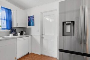 Stovetop, dishwasher, coffee/tea maker, dining tables