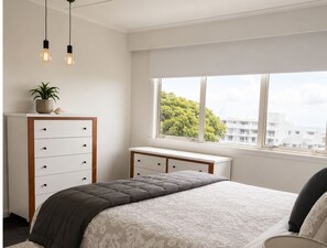 3 bedrooms, desk, iron/ironing board, travel cot - Bach By The Beach – Mount Maunganui Beach Accommodation (Mount Maunganui)