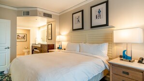 A hotel room with a large bed, two bedside lamps, a nightstand, a dresser, and framed artwork on the wall. - 2-bedroom resort in delightful Myrtle Beach with AC, fitness room (Myrtle Beach)