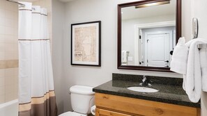 Jetted bath, hair dryer, towels, soap