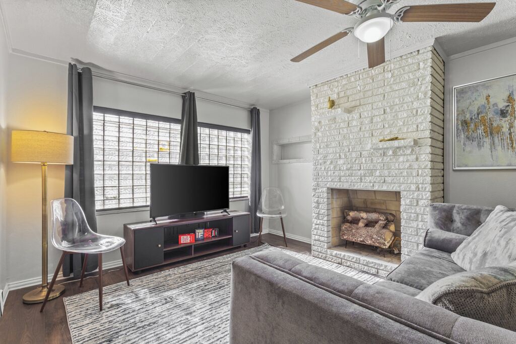 Smart TV, fireplace, books, printers