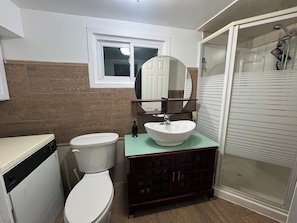 Shower, hair dryer, towels, soap