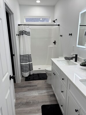 Shower, hair dryer, towels, soap