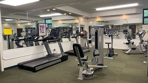 A gym with treadmills, weight machines, and exercise equipment. - Attitash Room: Pool, Hot Tub, Storyland, Foliage (Bartlett)