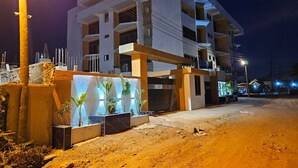 A multi-story building with a modern design, featuring balconies and large windows. - Skycity Hotel Gh (Amrahia)