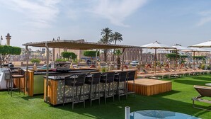 A rooftop bar with outdoor seating, a pool, and a view of the cityscape. - Sonesta Sun Goddess Nile cruise ship - 4 & 7 nights - From Luxor every Monday (Luxor)