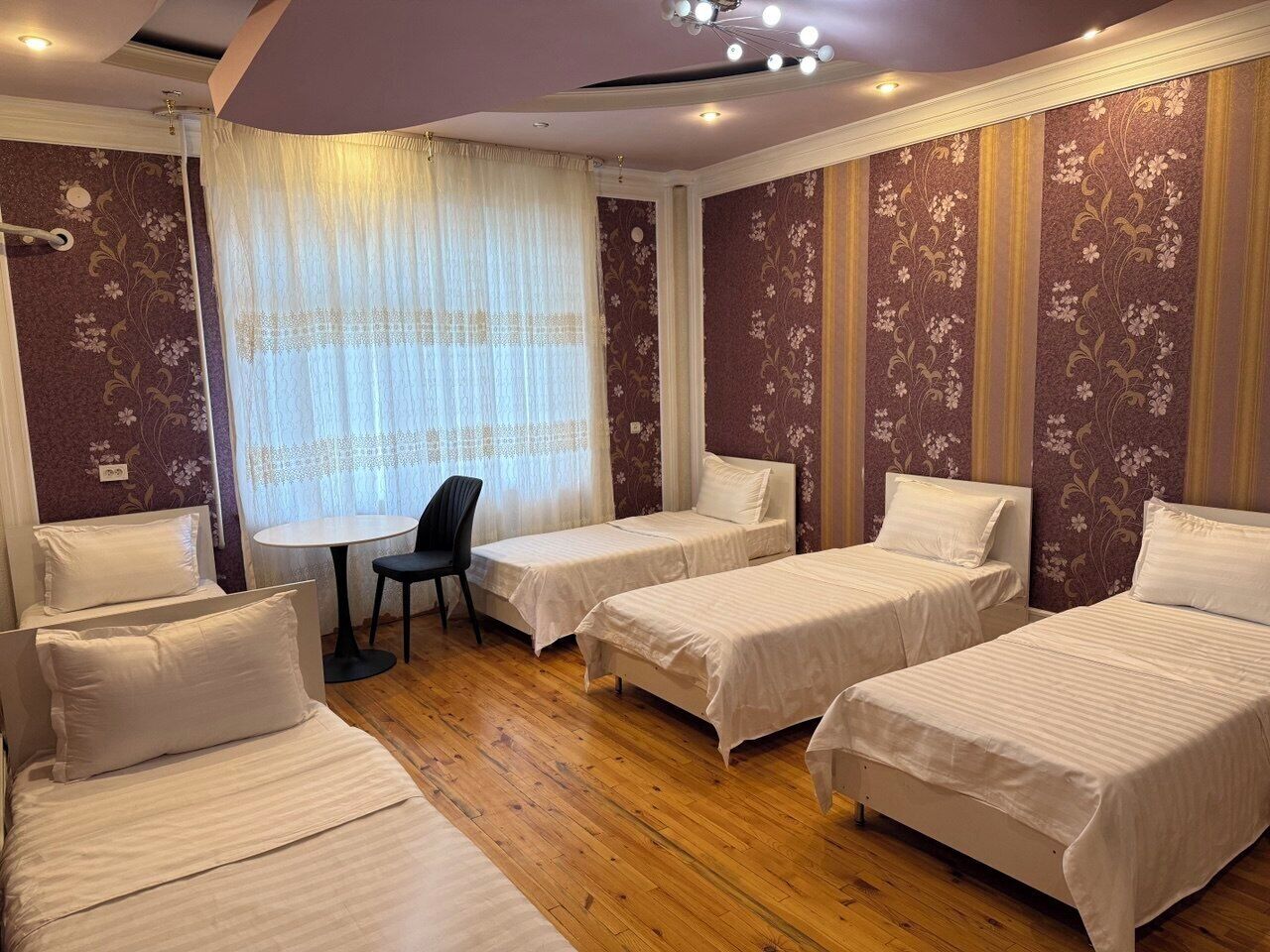 Quadruple Room | Laptop workspace, blackout drapes, iron/ironing board, free WiFi