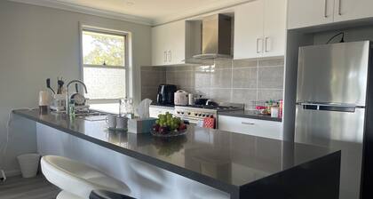 Modern, comfortable with stunning Inlet-sunset-view Home in the heart of Narooma