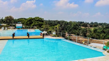 Outdoor pool, pool umbrellas, sun loungers