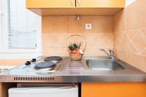 Fridge, stovetop, toaster, dining tables