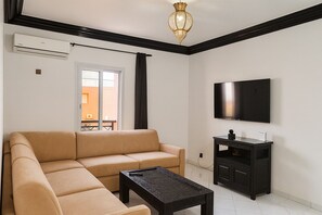 Deluxe Apartment, Balcony | Living area