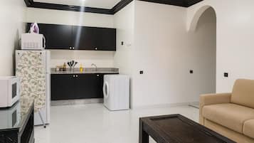 Deluxe Apartment, Balcony | Living area