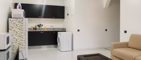 Deluxe Apartment, Balcony | Living area