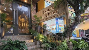 A staircase leading to a building with a sign reading "SHALVA HOMESTAY". - Shalva Homestay Catba (Hai Phong)