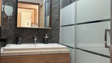 Shower, hair dryer, towels, soap