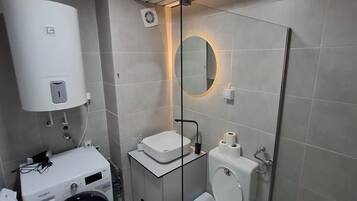 Shower, free toiletries, hair dryer, slippers
