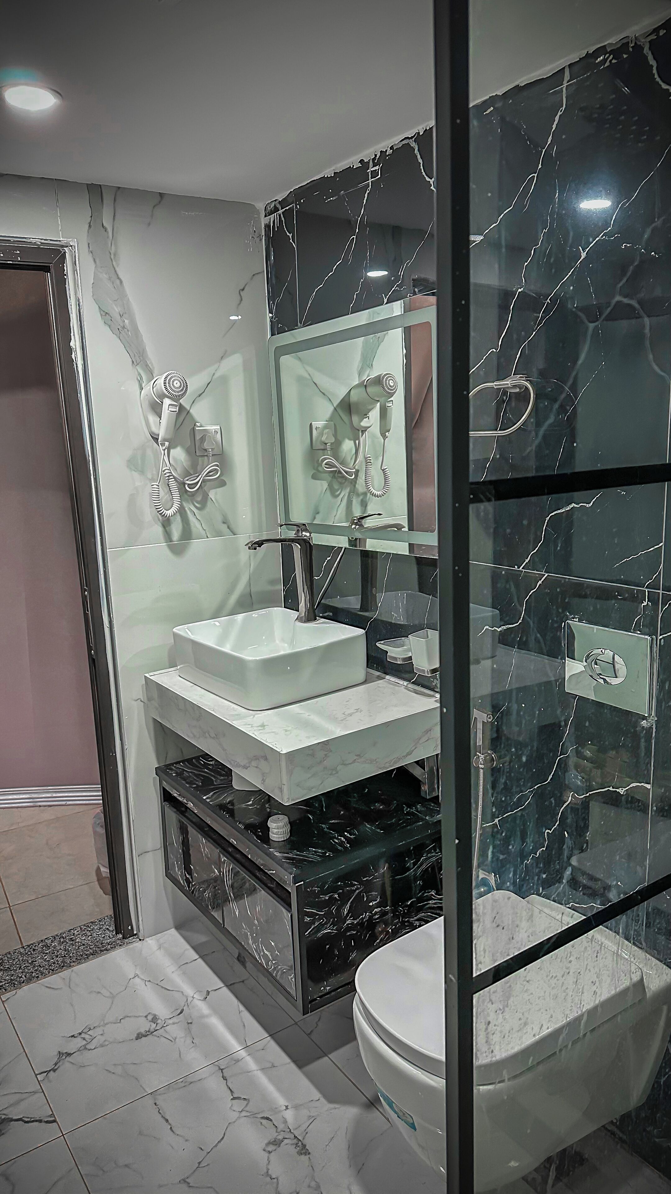 Separate bathtub and shower, towels, soap, shampoo