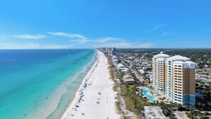 A beach resort with a long sandy beach, a pool, and high-rise buildings. - 4 BR En Soleil Directly on Gulf, 5th floor unit with the best views!! (Panama City Beach)
