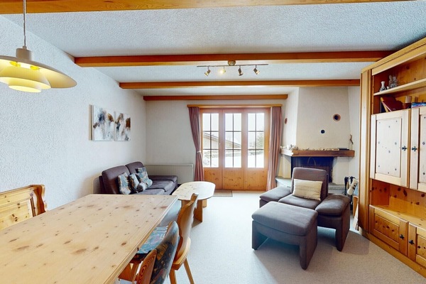 Living and dining area with two fold-away beds