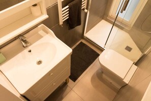 Shower, hair dryer, towels, soap