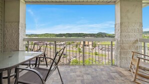 A balcony with a view of a cityscape and hills. - One Bedroom, One Bath Condo in Pigeon Forge, City View,  A couple's getaway (Pigeon Forge)