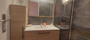Shower, towels, soap, toilet paper