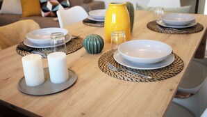A dining table set with plates, candles, and a vase. - Tuscany Best Point [30 min by train to Florence] (Stazione)