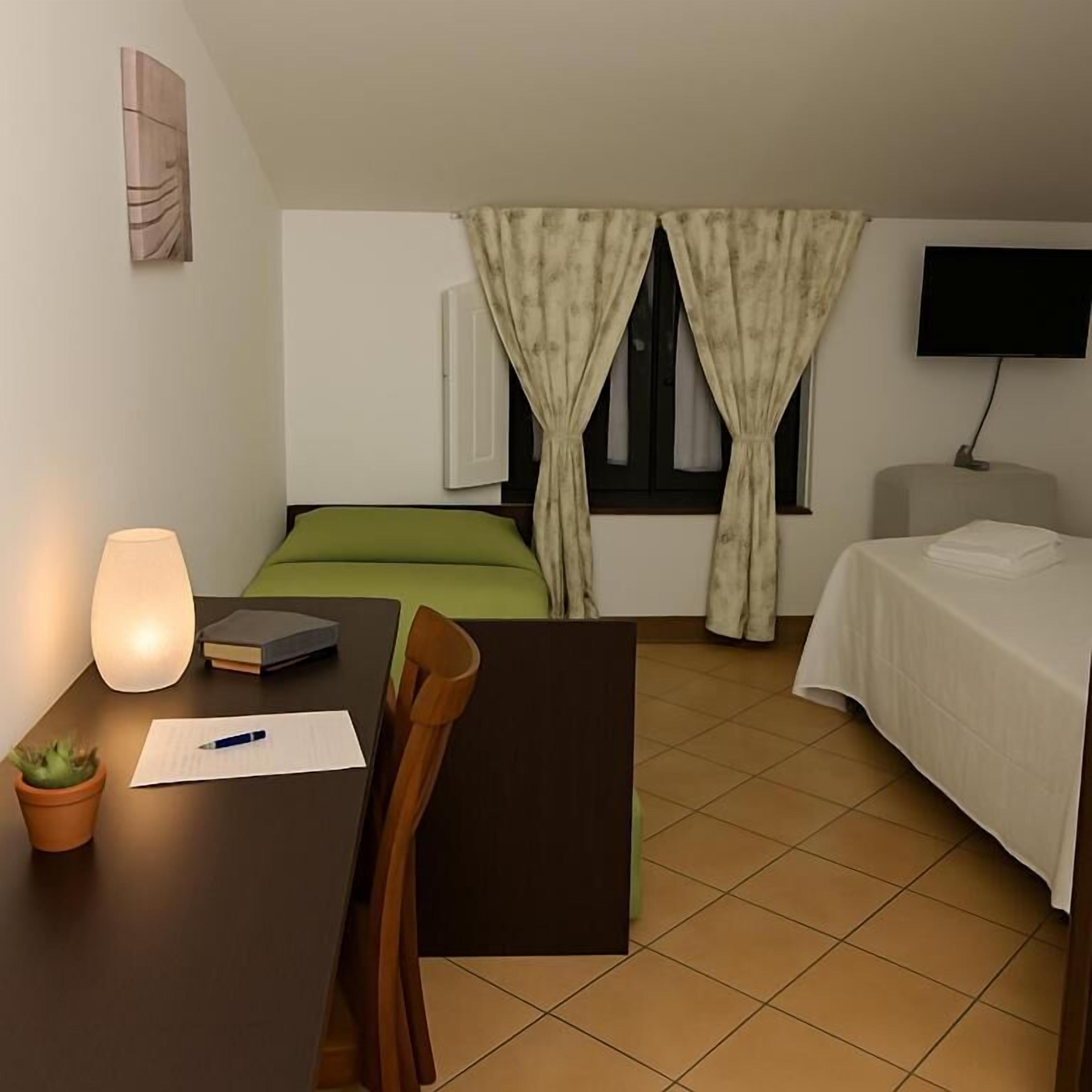 Triple Room | Desk, laptop workspace, blackout drapes, free WiFi