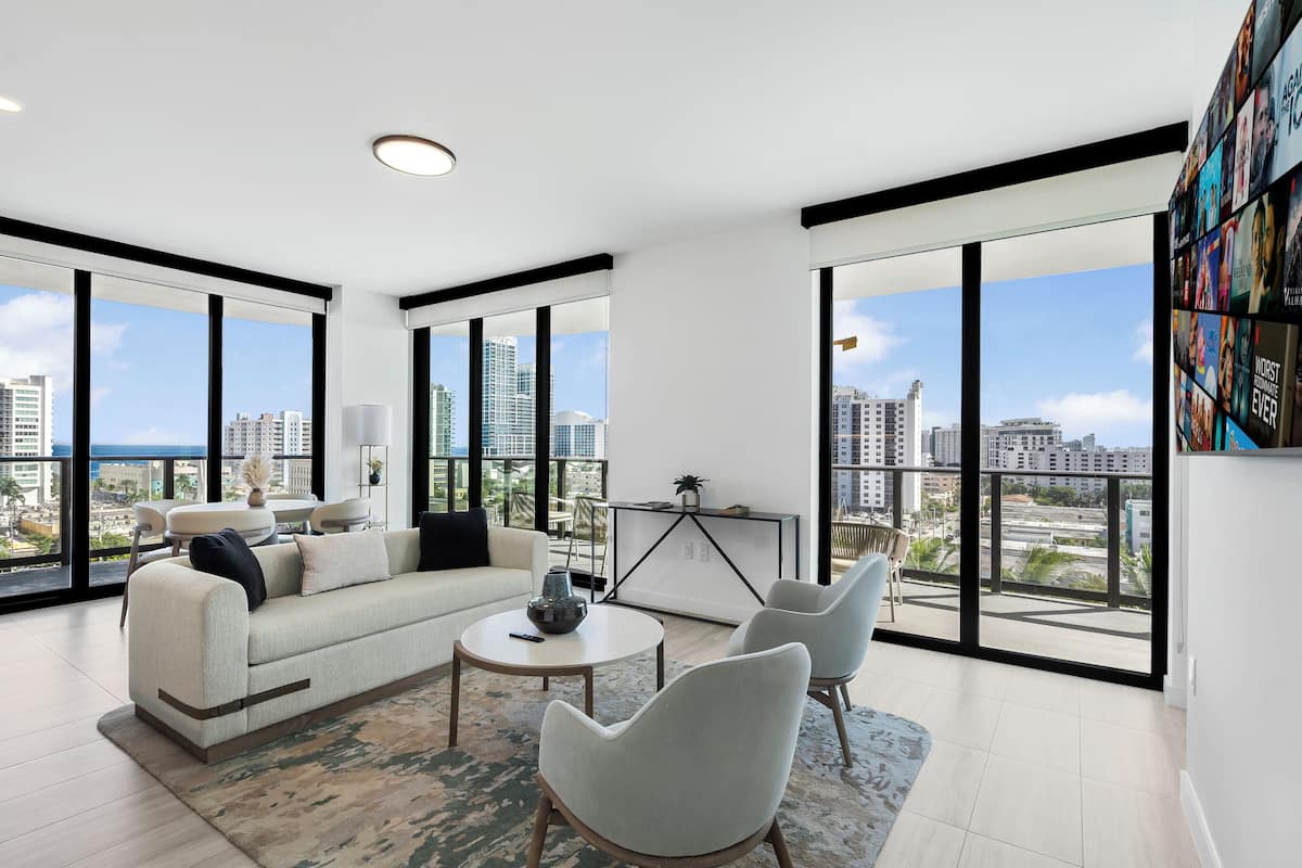 Luxury Condo, Balcony, City View | Living area | 10-inch Smart TV with cable channels