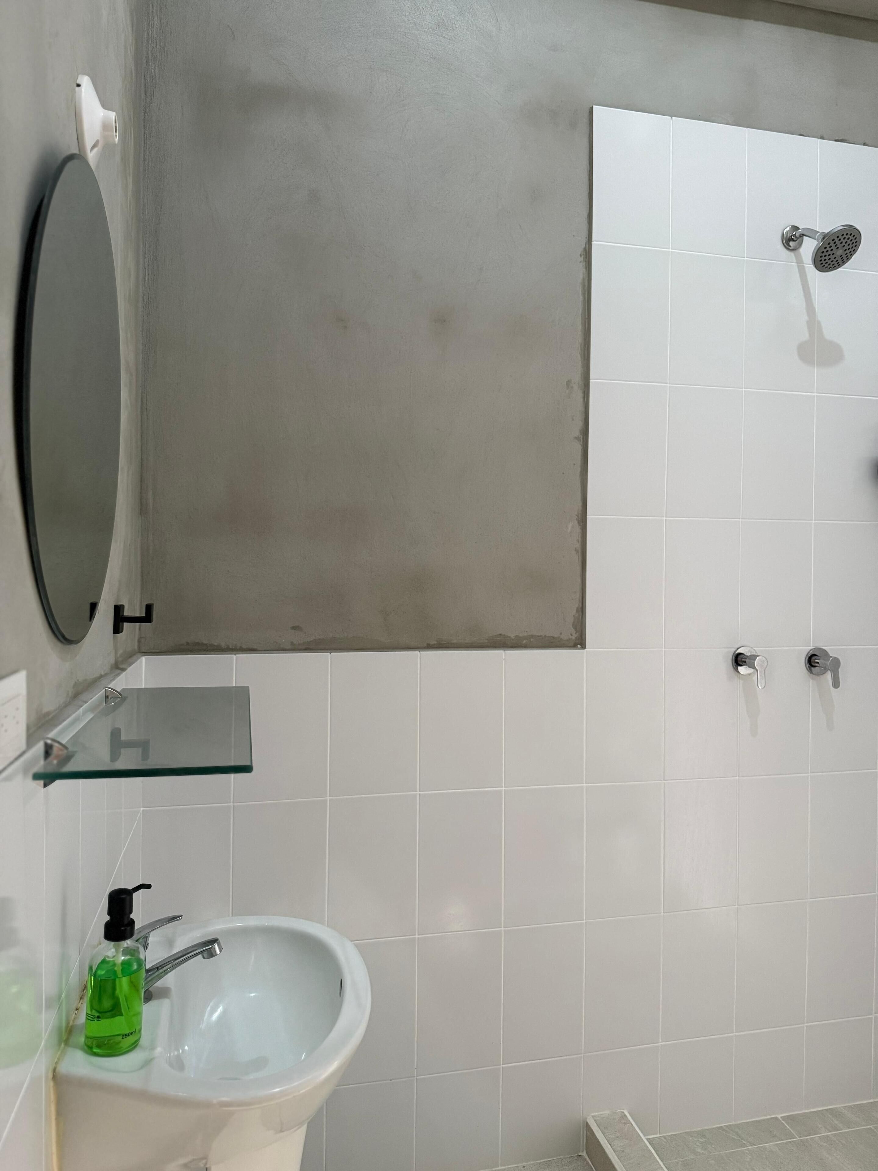 Shower, hair dryer, towels, toilet paper