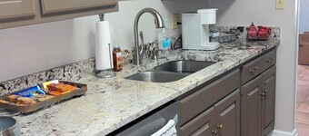 Charming condo 3-bedroom 2 bath, 2 living rooms! Stocked kitchen, laundry room