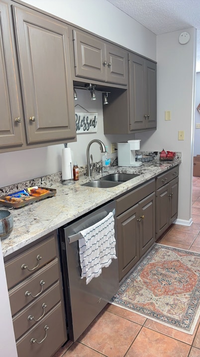 Charming condo 3-bedroom 2 bath, 2 living rooms! Stocked kitchen, laundry room