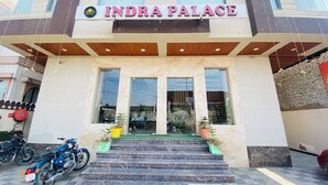 The exterior of a building with a sign reading "INDRA PALACE". - INDRA PALACE (Jaipur)