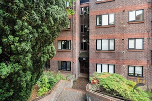 A multi-story brick building with a courtyard.