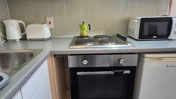 Departamento Confort, vista a la ciudad | Cocina privada