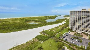 A hotel with a view of a coastal area, including a beach and mangrove forest. - Gorgeous 17th fl sunsets @ South Seas 2BR/2BA NEW mattresses updated furnishings (Marco Island)