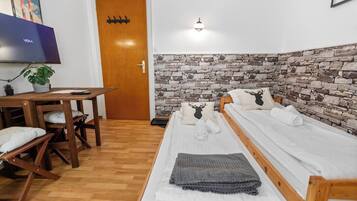 Iron/ironing board, travel crib, WiFi, bed sheets