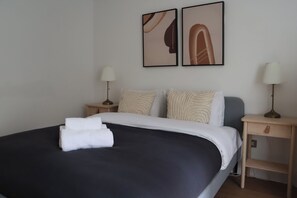 1 bedroom, desk, iron/ironing board, travel crib