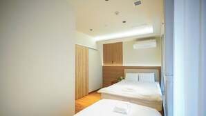 豪華套房, 2 間臥室, 私人浴室, 城市景觀 | 書桌、免費無線上網、床單