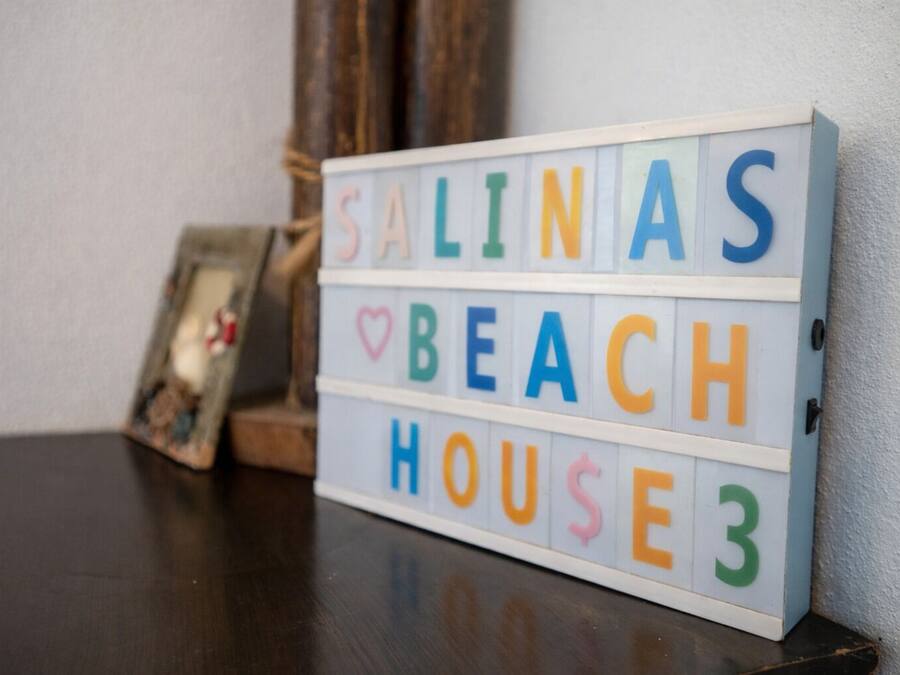 A lightbox with the text "SALINAS BEACH HOUSE" in colorful letters.