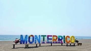 On the beach, black sand