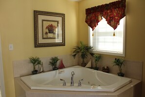 Jetted tub, towels, toilet paper