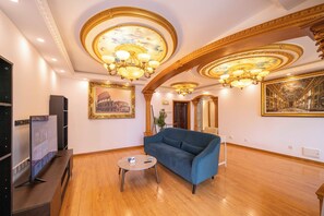 Superior Apartment, 1 Bedroom, Kitchen, City View | Living room | 55-inch Smart TV with cable channels