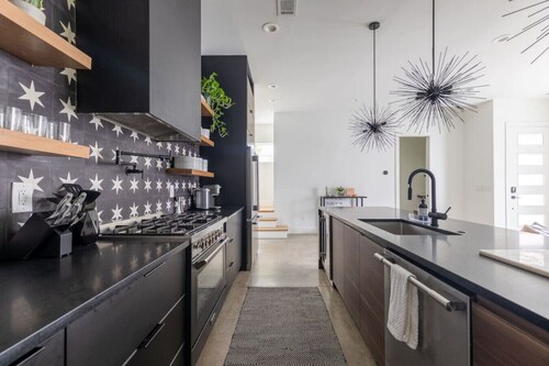 Modern Oasis: Rooftop Sunsets & City Lights!