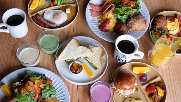 A variety of breakfast dishes on plates, including eggs, bacon, and sandwiches. - B&D HAKUBA IWATAKE (Hakuba)