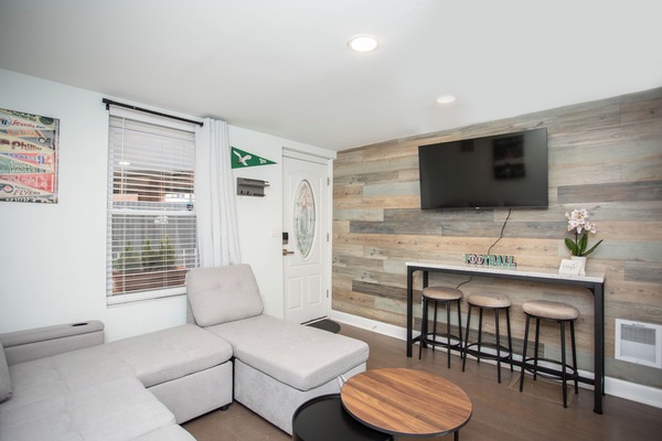 Sunny, cozy living room with smart TV—perfect for unwinding after exploring.