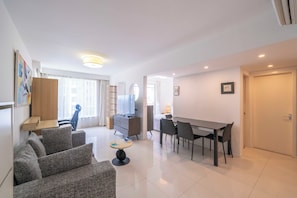 Superior Apartment, 1 Bedroom, Kitchen, City View | Living room | 55-inch Smart TV with cable channels